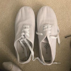 All White Vans style sneakers